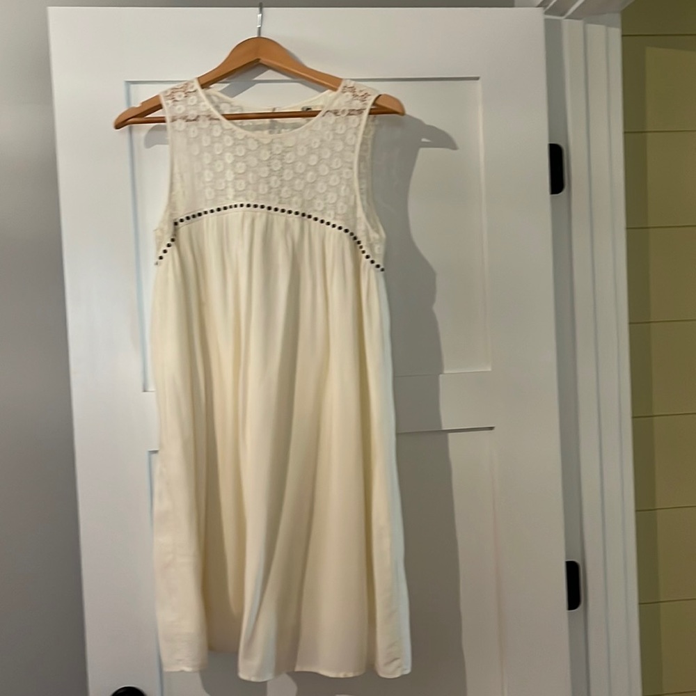 Such a great dress!! One small spot on front ( in photos). Lace & stud details.